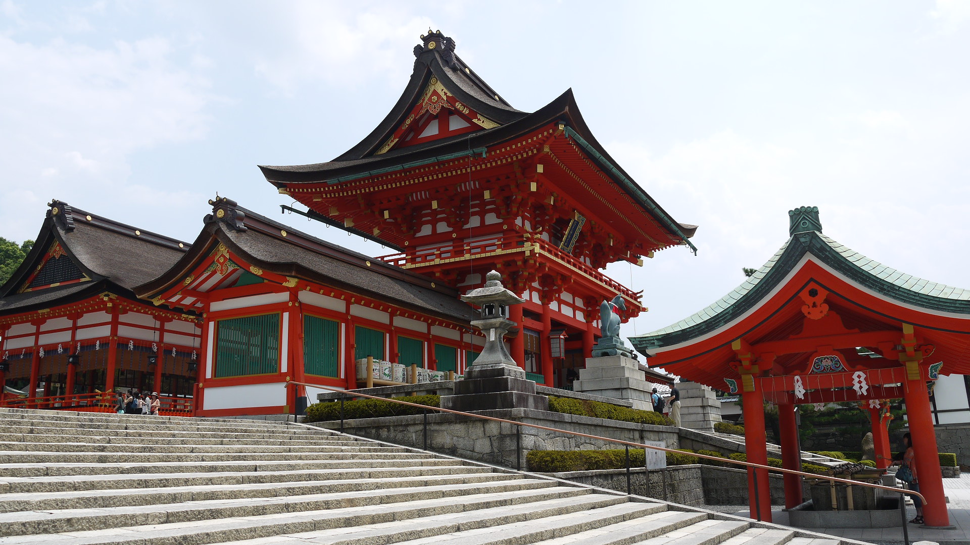 A close-up view of the torii gates with inscriptions.