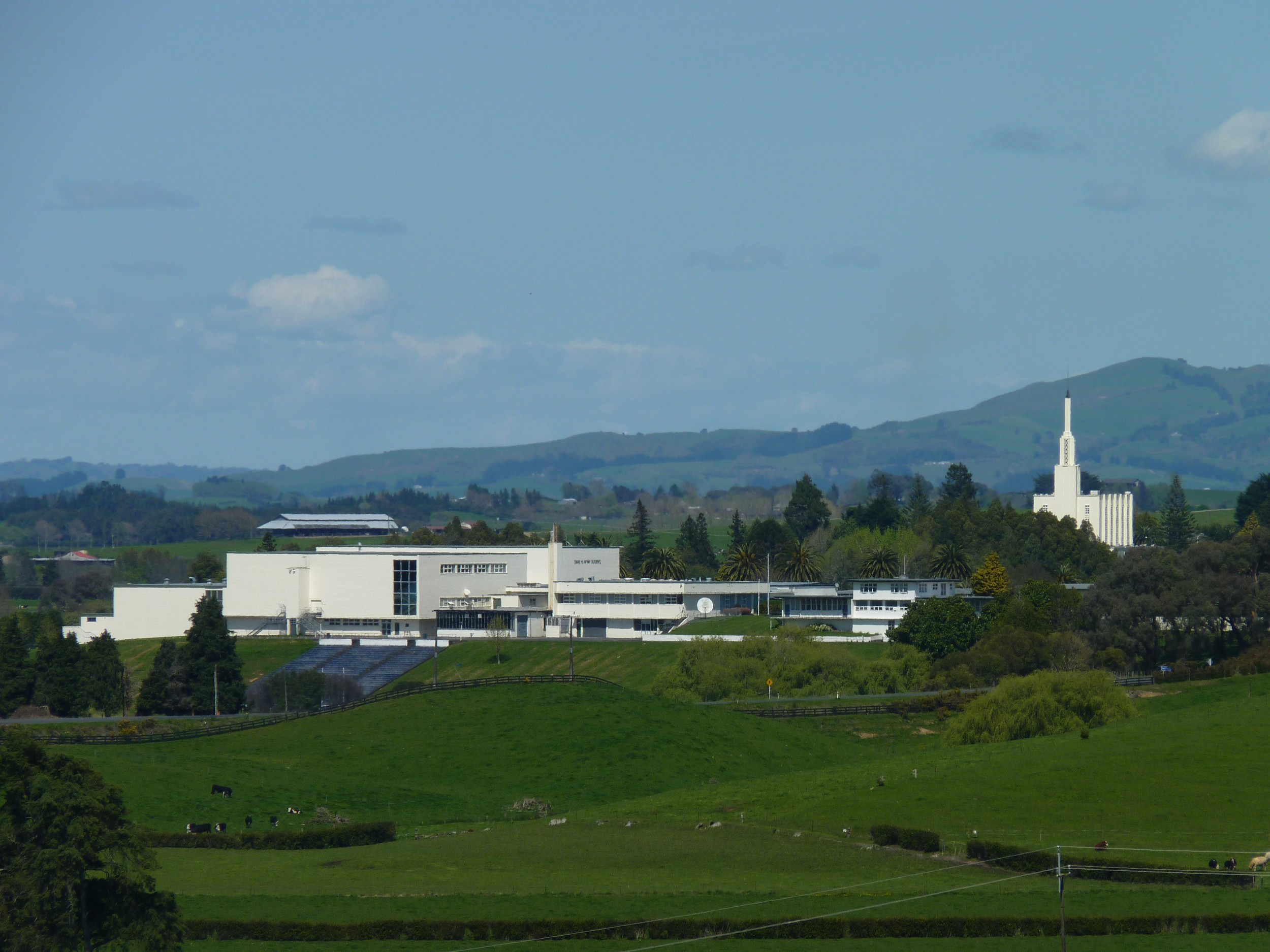 The Hamilton New Zealand Temple surrounded by trees.
