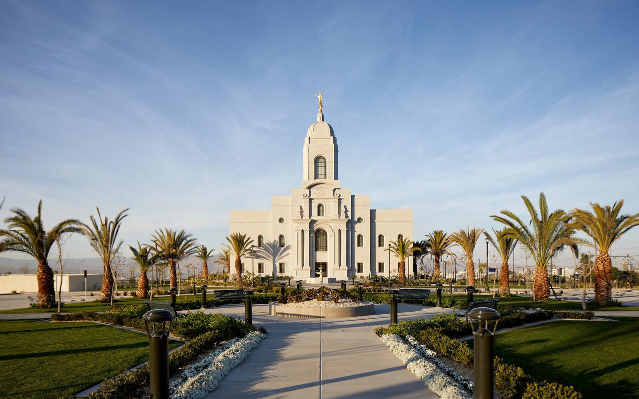A serene view of the temple grounds, showcasing the beautiful landscaping and architecture.