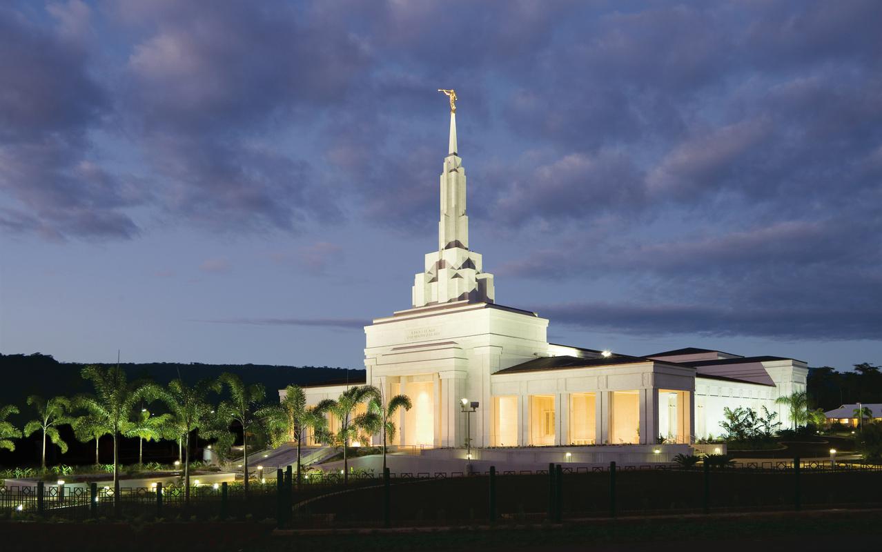 The Apia Samoa Temple surrounded by lush greenery.