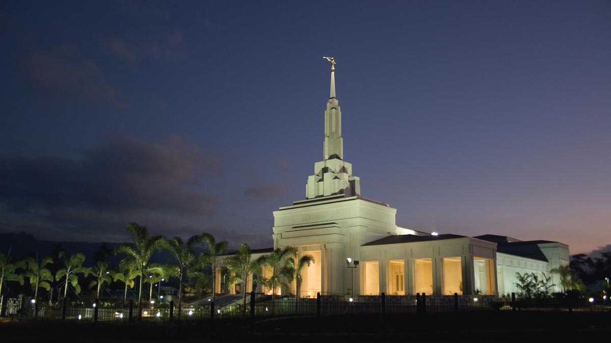A serene view of the Apia Samoa Temple at dusk.