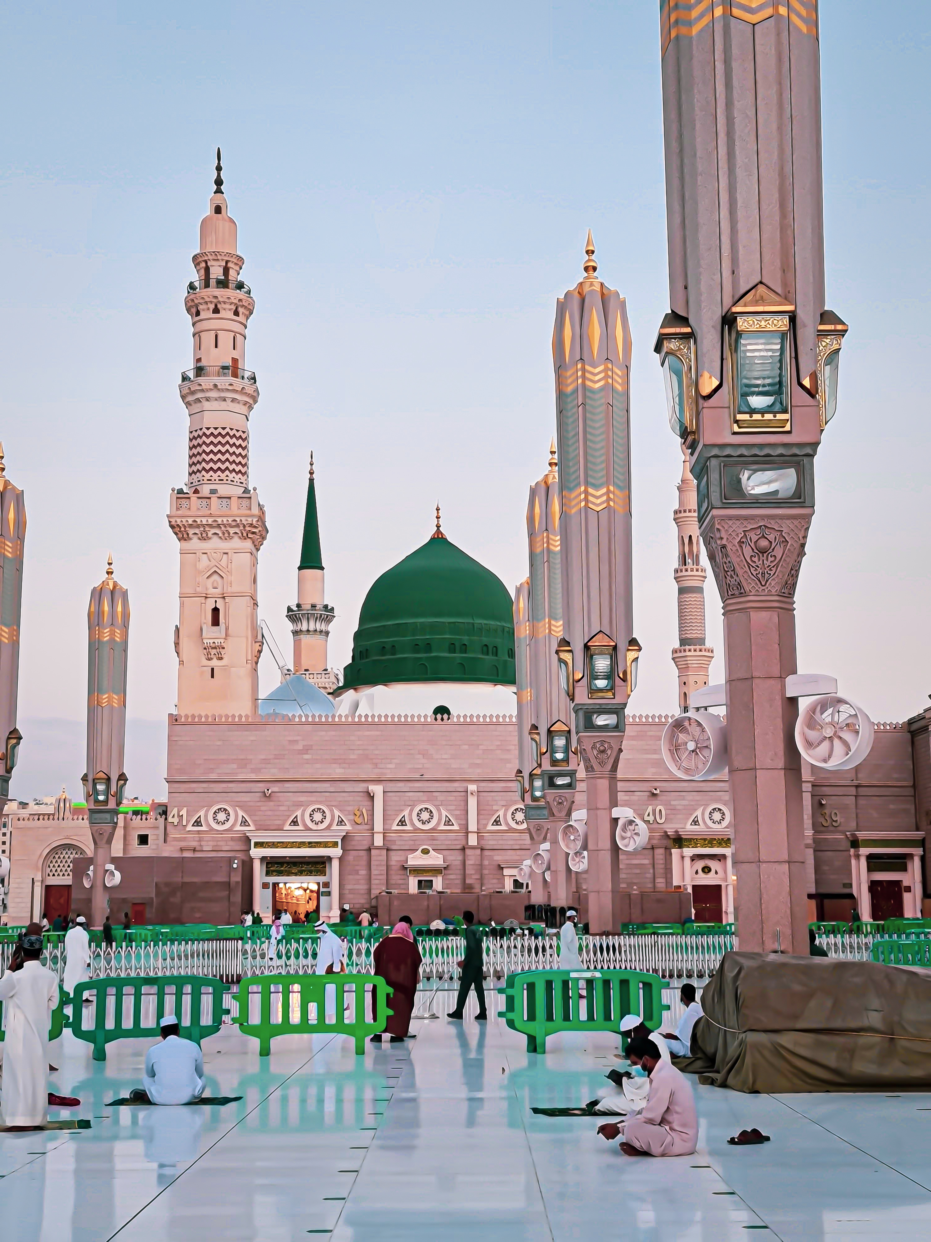 The mosque's courtyard filled with umbrellas providing shade for visitors.