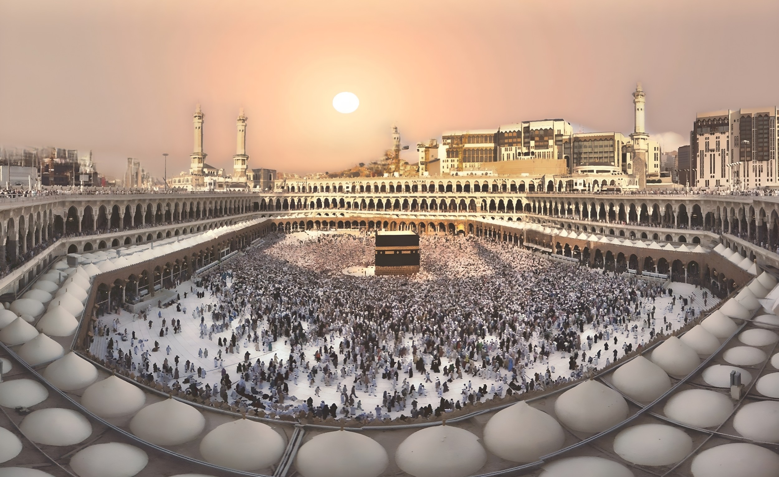 A panoramic view of the Masjid al-Haram with the Kaaba at its center.