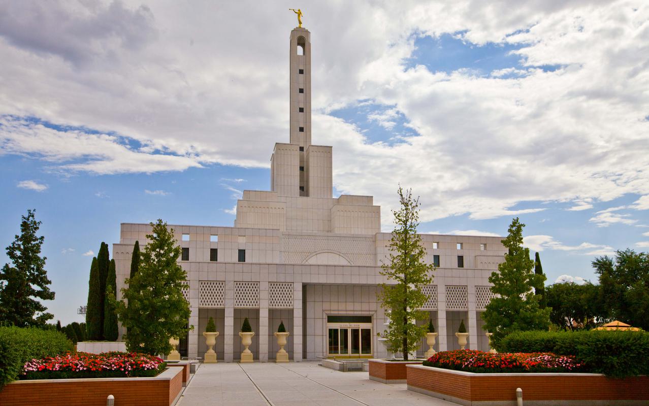 The temple is illuminated at night, creating a serene atmosphere.