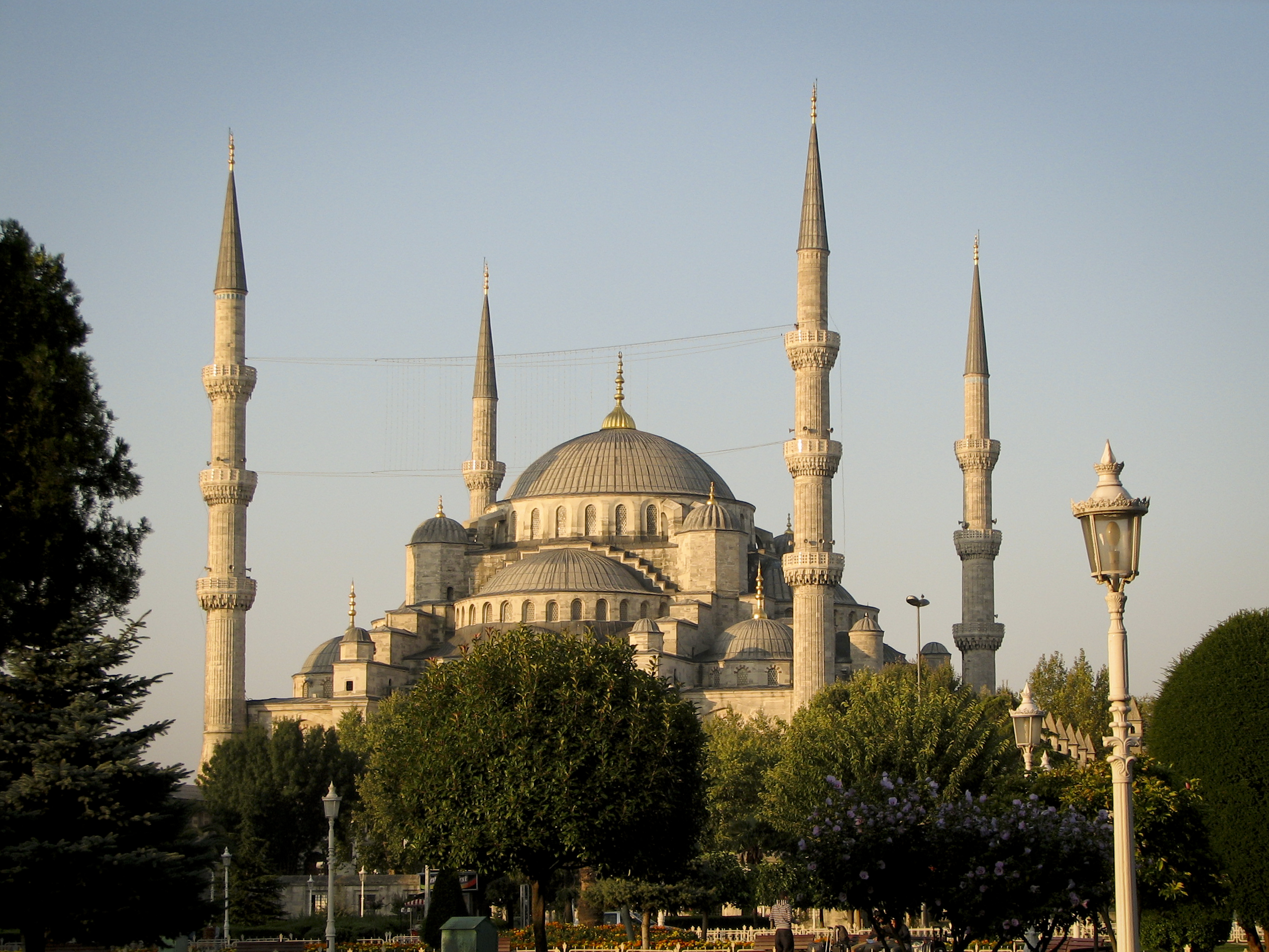 Worshippers inside the Blue Mosque, experiencing its spiritual ambiance.