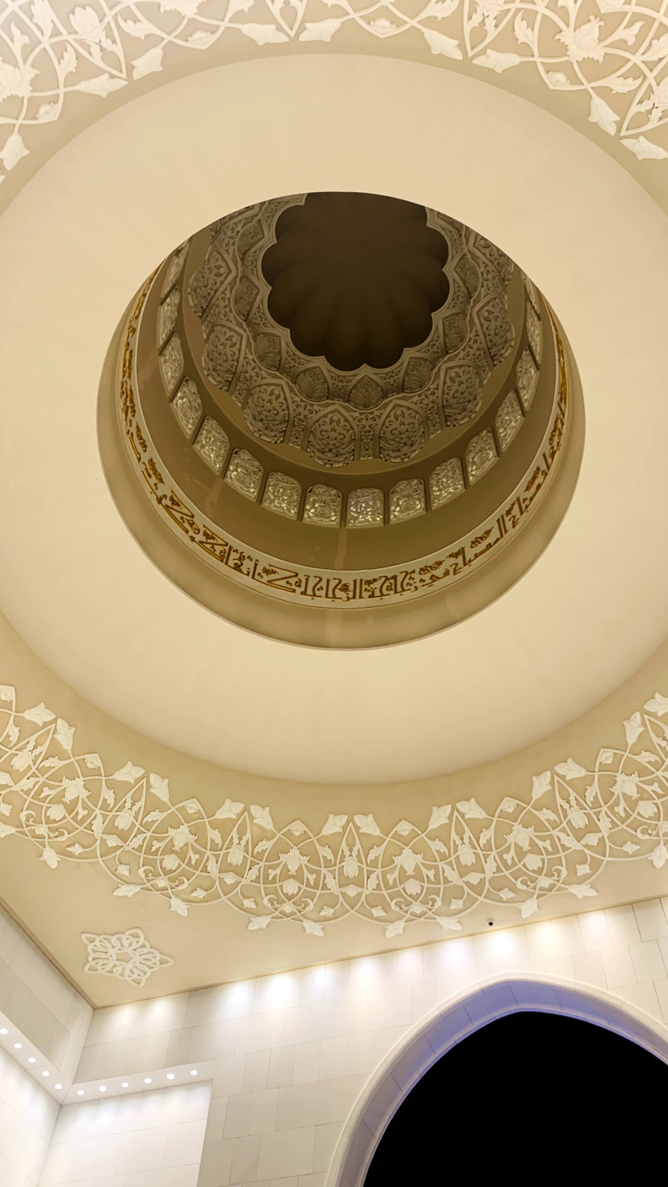 The Sheikh Zayed Grand Mosque at dusk, showcasing its stunning architecture.