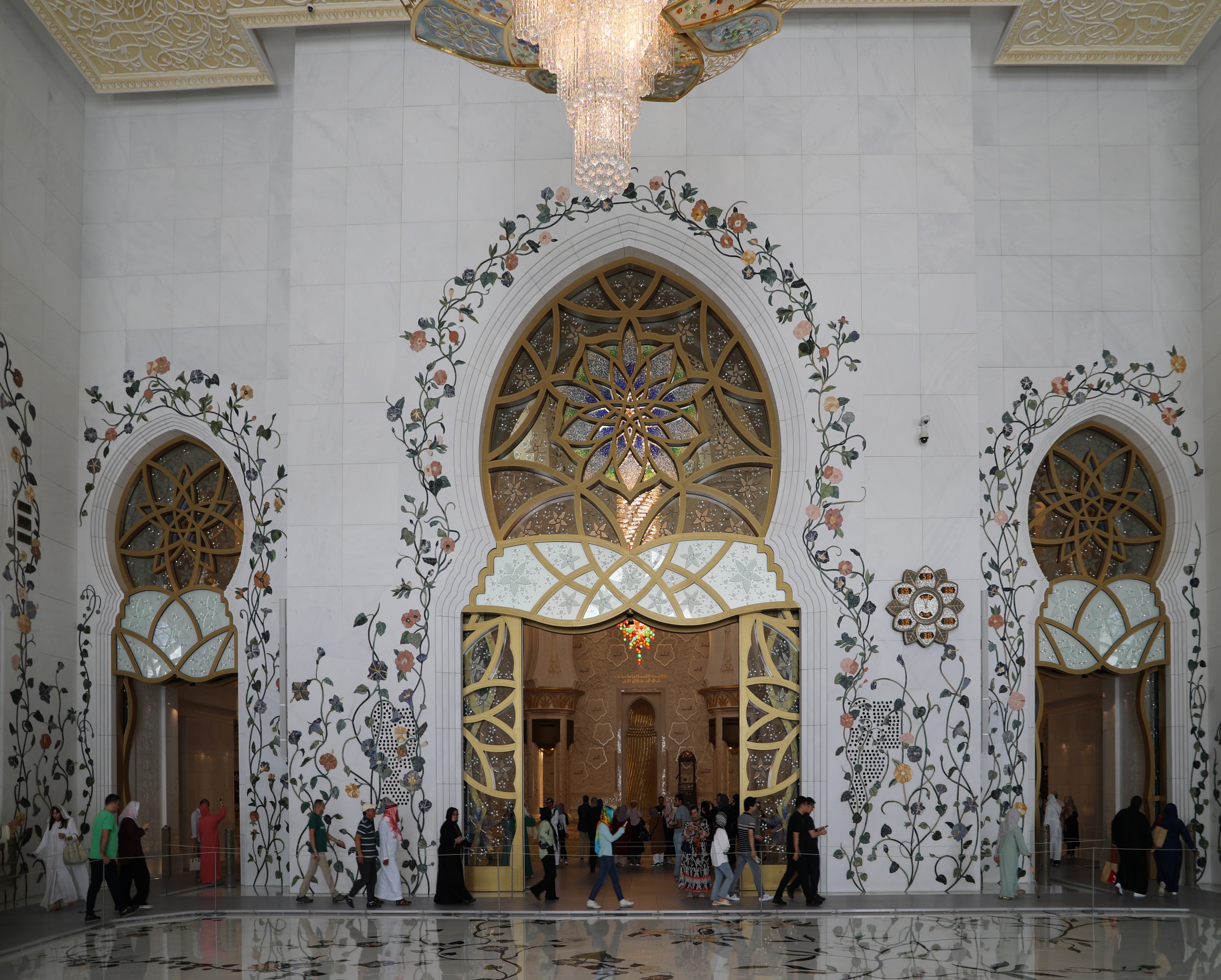 A view of the mosque's courtyard, adorned with intricate floral designs.