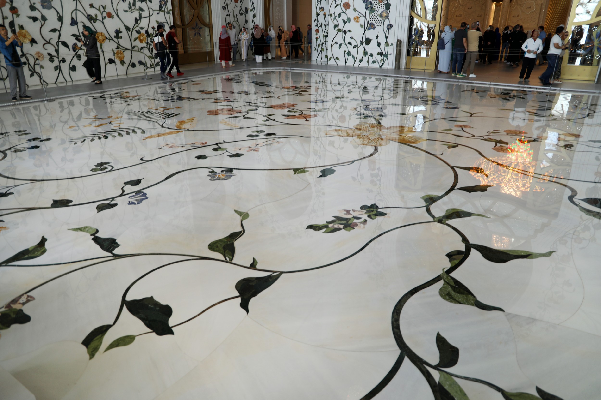 The Qibla wall, featuring the 99 names of God in traditional Kufic calligraphy.