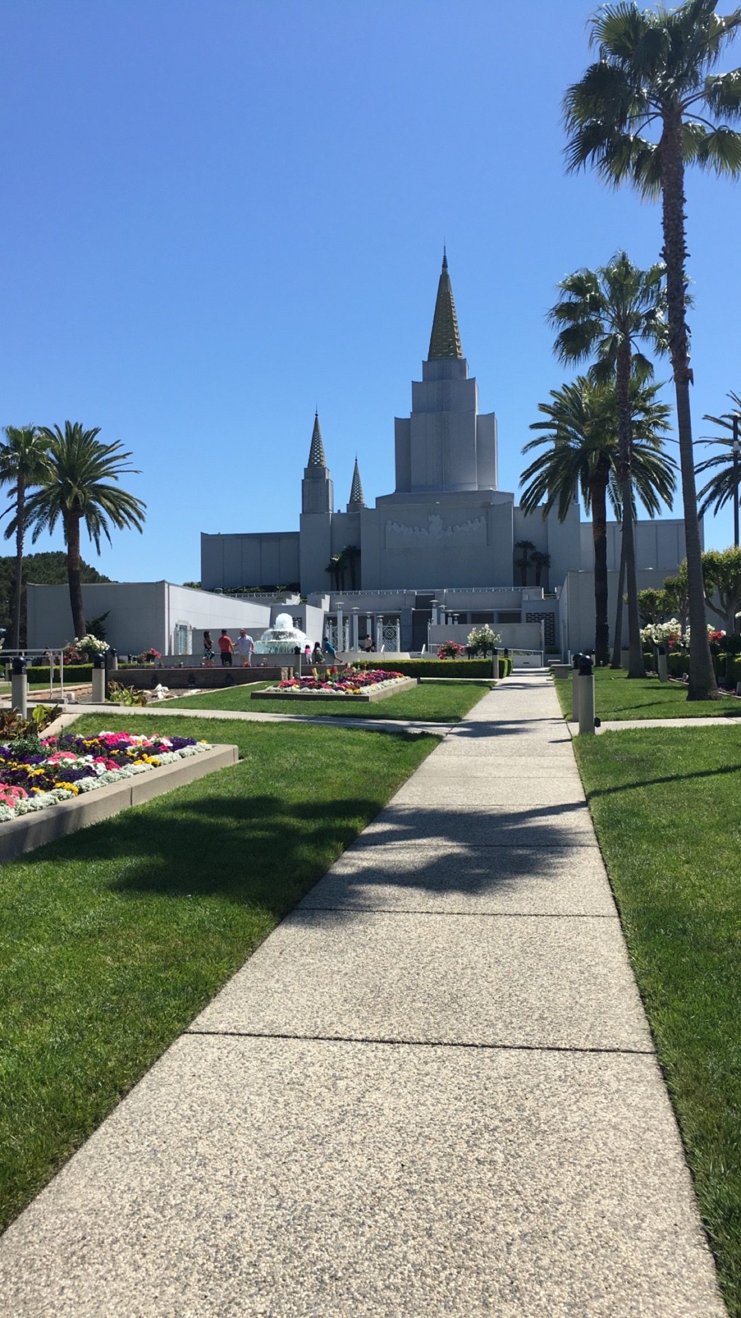 The temple's five spires reaching heavenward against a clear blue sky.
