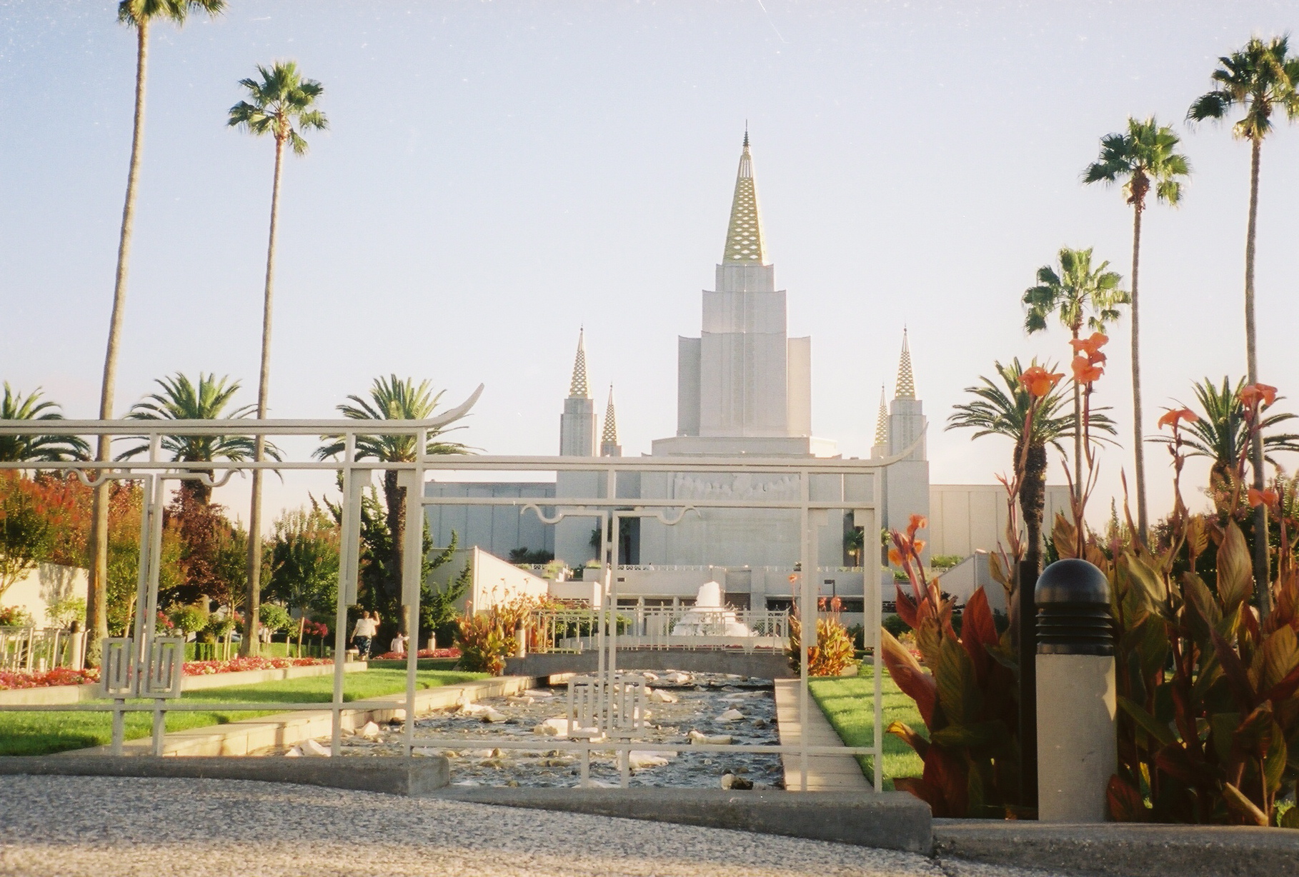 A serene creek flowing through the lush temple grounds.