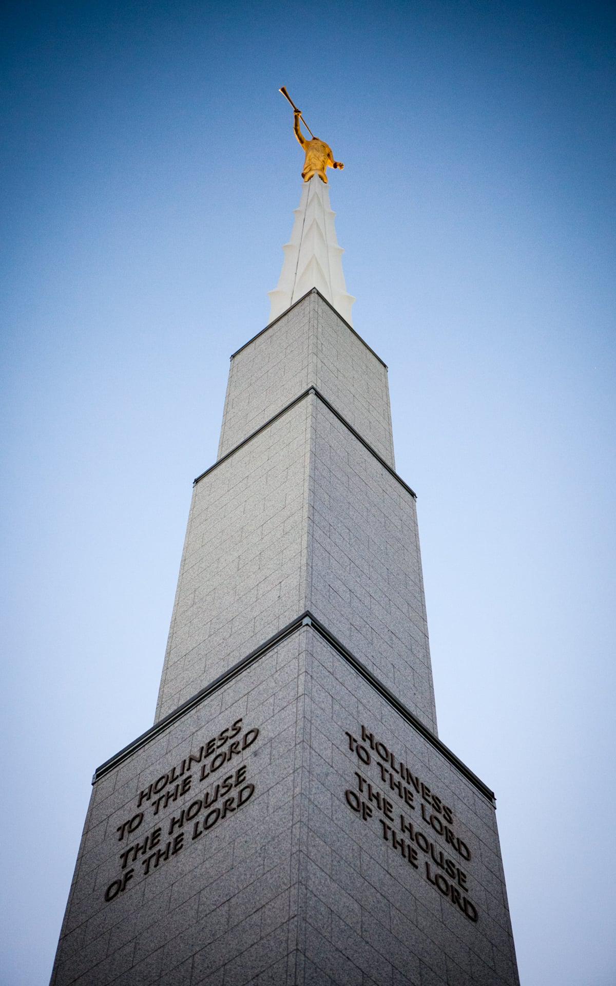Temple illuminated at twilight against the Boise sky