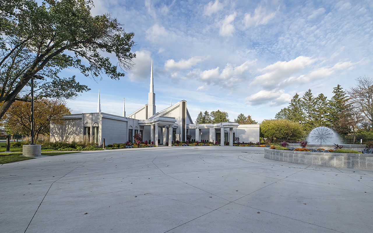 The Angel Moroni statue atop the 112-foot tallest spire against a Midwest sky.