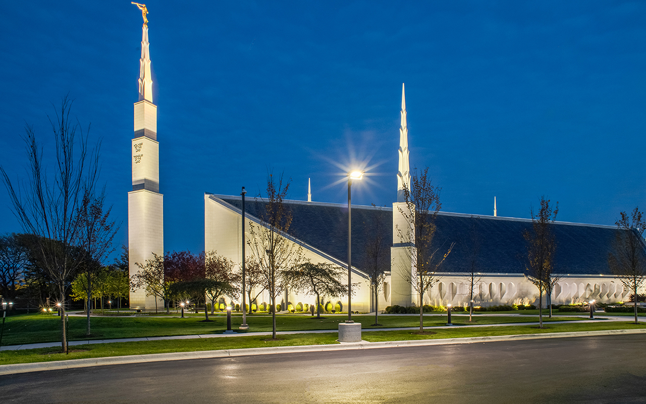 The temple illuminated at dusk, its spires catching the last light of day.