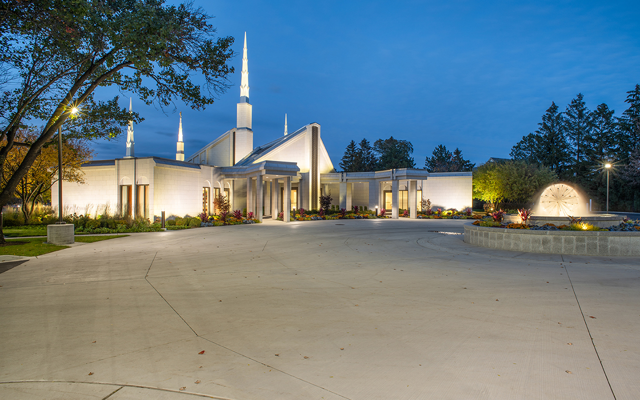 The peaceful grounds with walking paths winding through mature trees and gardens.