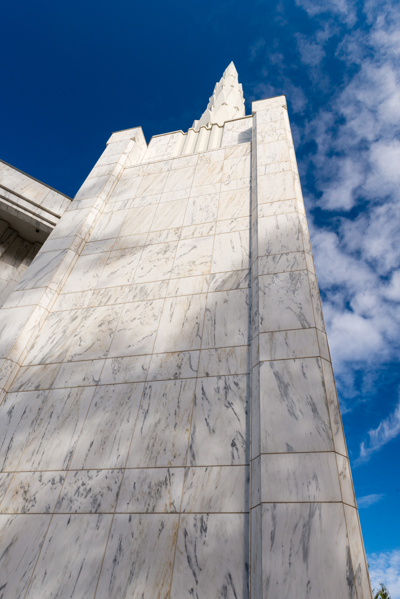 Close-up of the translucent white marble cladding and spire tip