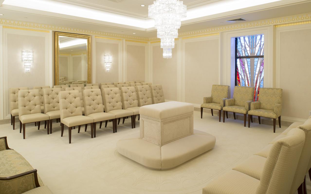 A serene view of the temple grounds with vibrant flowers.