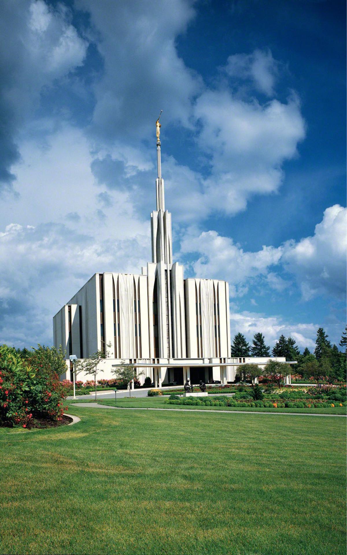 A view of the temple grounds with colorful flowers.
